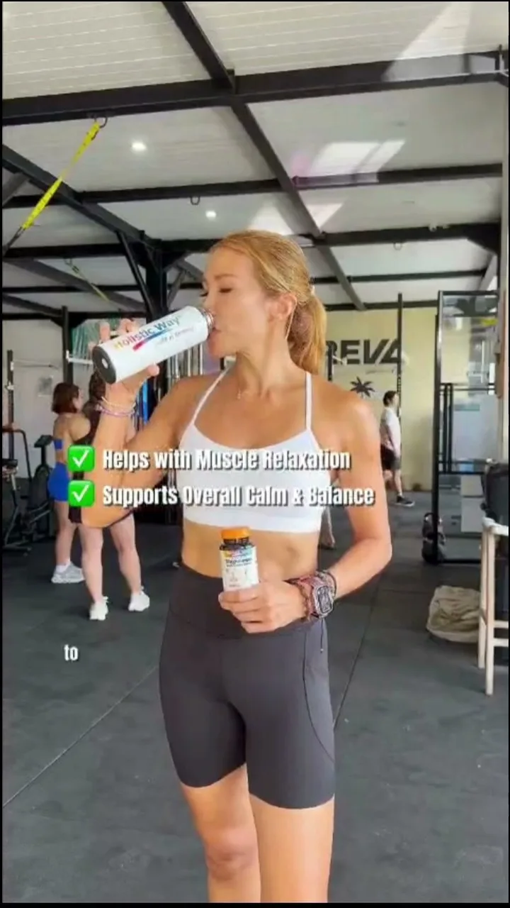 Creator drinking a Holistic Way supplement at the gym in Bali